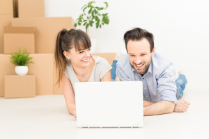 Young people move into a new apartment.